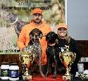 BRANDON TARQUINIO WITH HIS DOG QUINN WHO IS THE 2022 OPEN POINTING NATIONAL CHAMPION AND BRANDON'S DOG RAZZ WHO IS THE 2022 OPEN POINTING RESERVE CHAMPION. CONGRATULATIONS BRANDON.